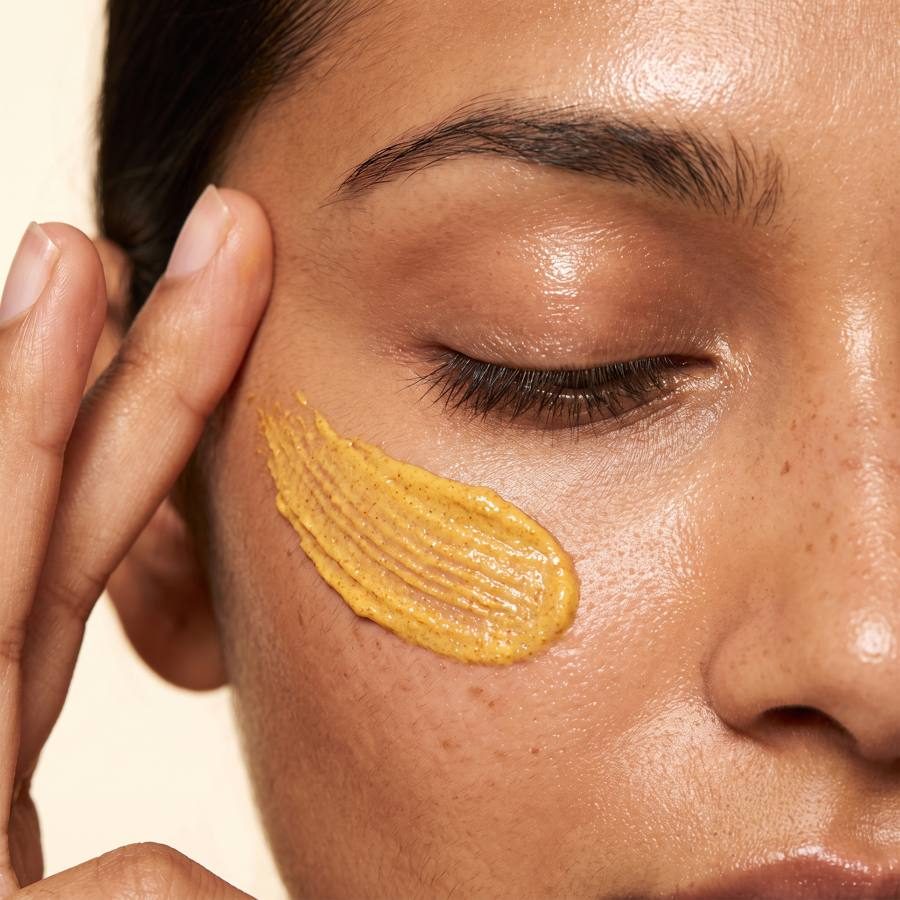 Applying turmeric cream